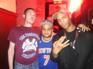 A scene from last night's outing of the NYC Oi! Fest: Two men of color standing with a guy wearing the T-Shirt of the Wrongdoers, a Finnish Nazi band. This is why we call them boneheads.