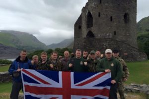 Members of Britain First pose in front of Dolbadarn Castle