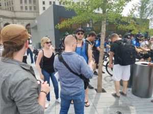 Rebecca, wearing the black blouse, and Matt Christensen, standing next to her with the baseball cap meet up with Nathan Damingo of Identity Evropa (formerly National Youth Front), in forefront, back turned to camera